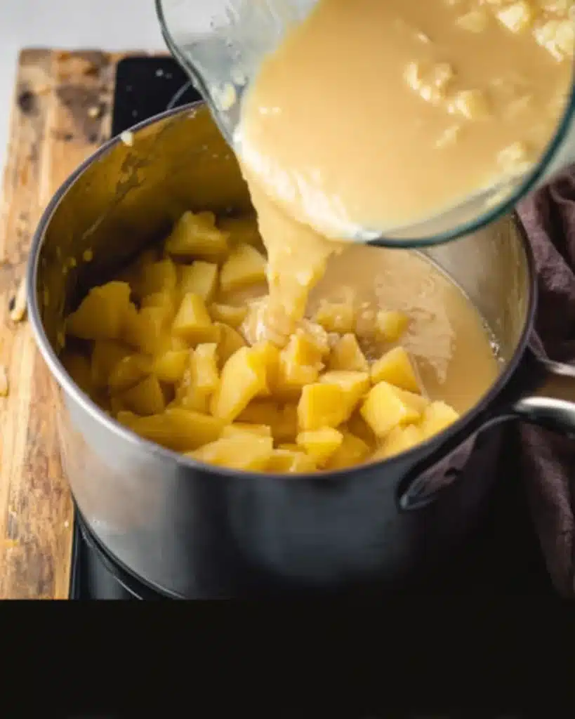 Cheddar Cheese Potato Soup Recipe 4 Blended potatoes poured back into soup pot with broth and chunks