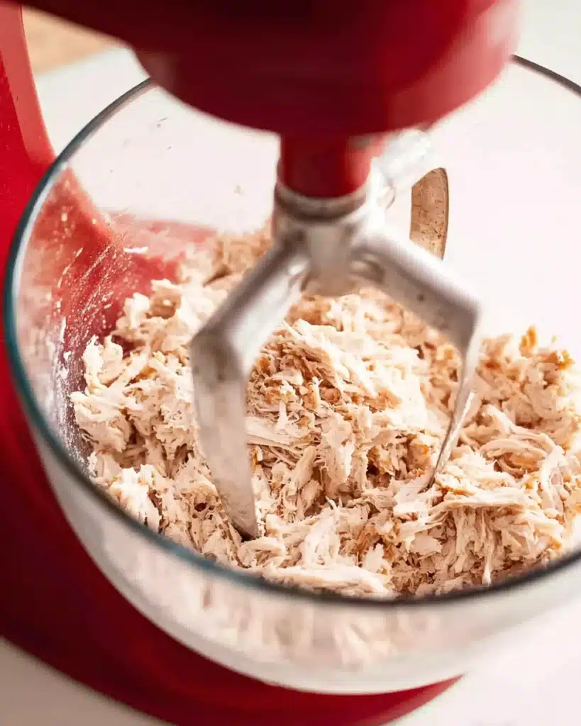 Chicken Sandwiches – Easy, Creamy, and Perfect for Lunch! 2 Shredded chicken in glass bowl for chicken sandwiches