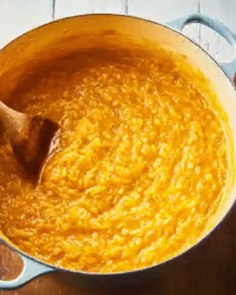 Creamy baked pumpkin risotto in a Dutch oven ready to serve