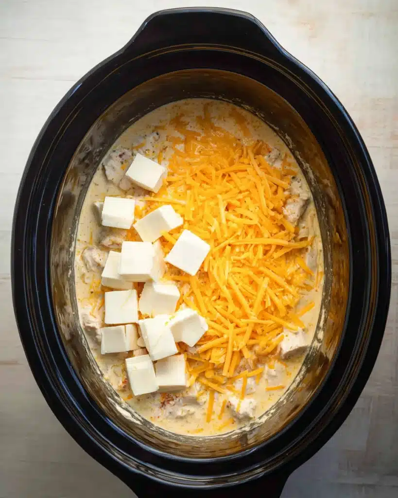 CrockPot Cheesy Chicken Spaghetti Recipe 4 Shredded cheddar and cream cheese added to CrockPot Cheesy Chicken Spaghetti