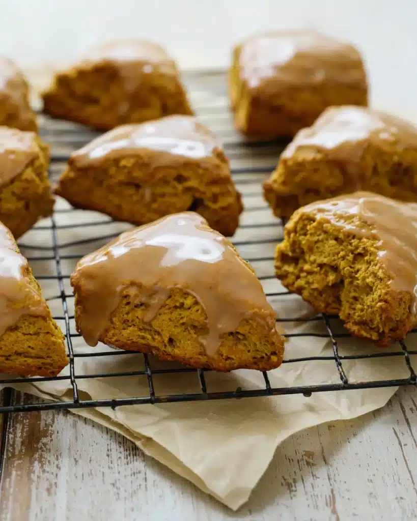 Pumpkin Scones Recipe – Perfect Fall Treat 1 Pumpkin scones with spiced glaze cooling on a wire rack