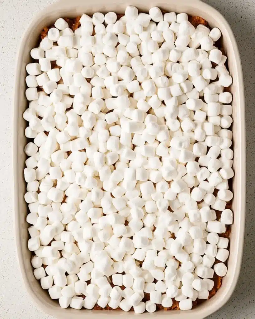 Unbaked sweet potato casserole topped with mini marshmallows