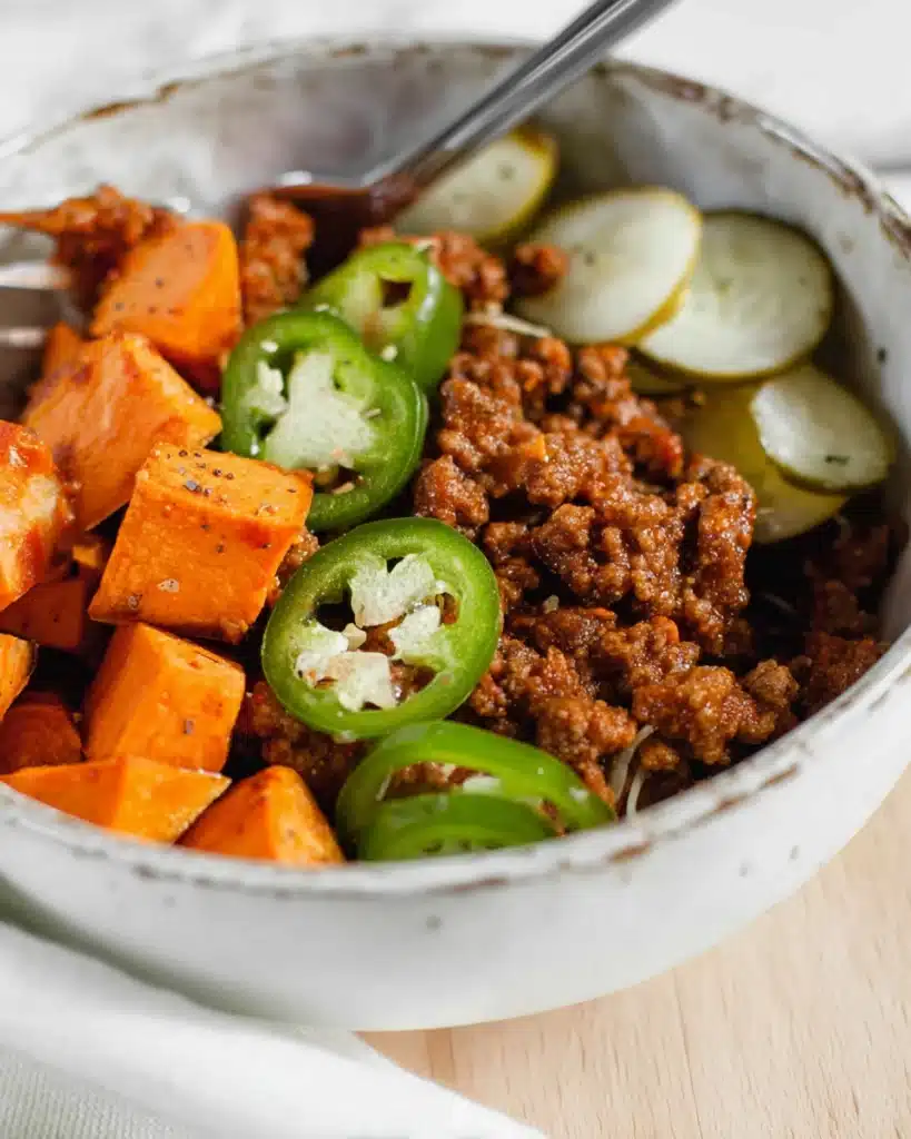 Whole30 sloppy joes bowl with roasted sweet potatoes, jalapeños, and pickles