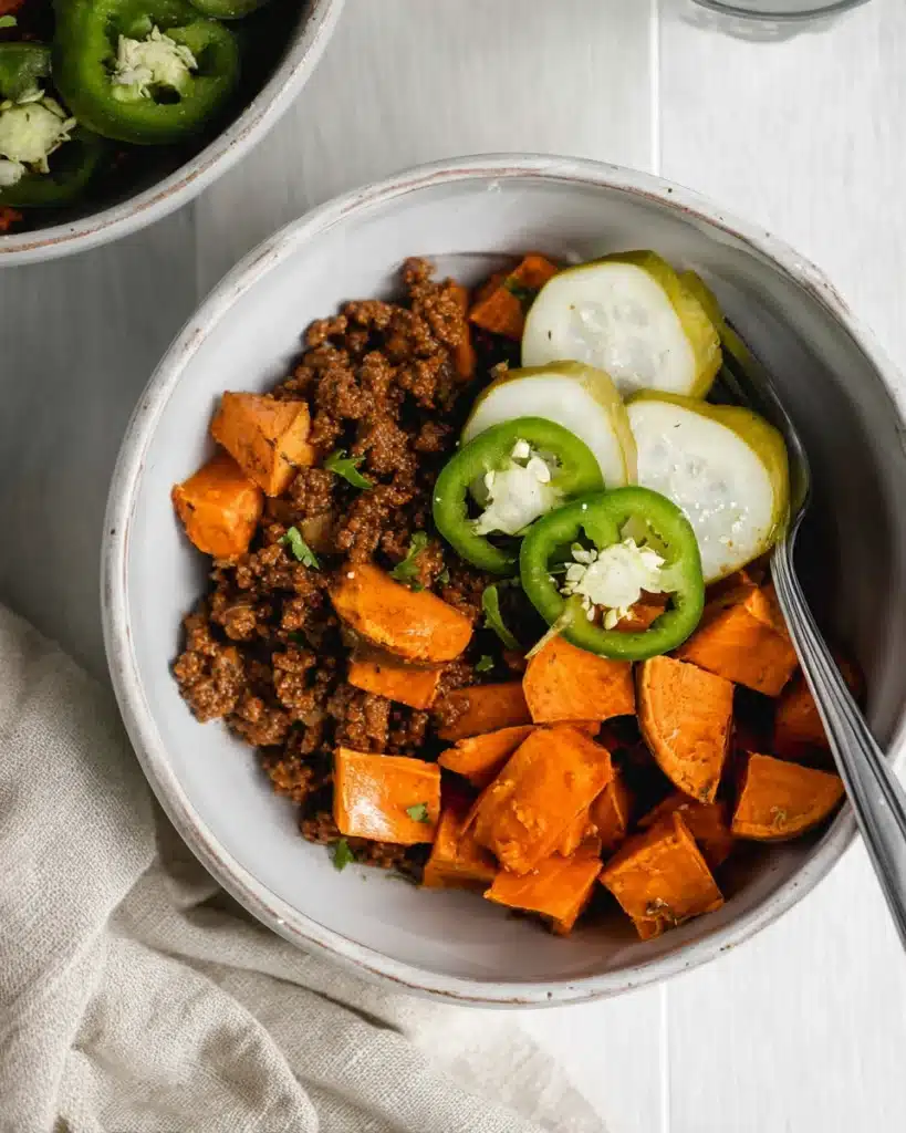 Whole30 sloppy joes bowl with roasted sweet potatoes, jalapeños, and pickles