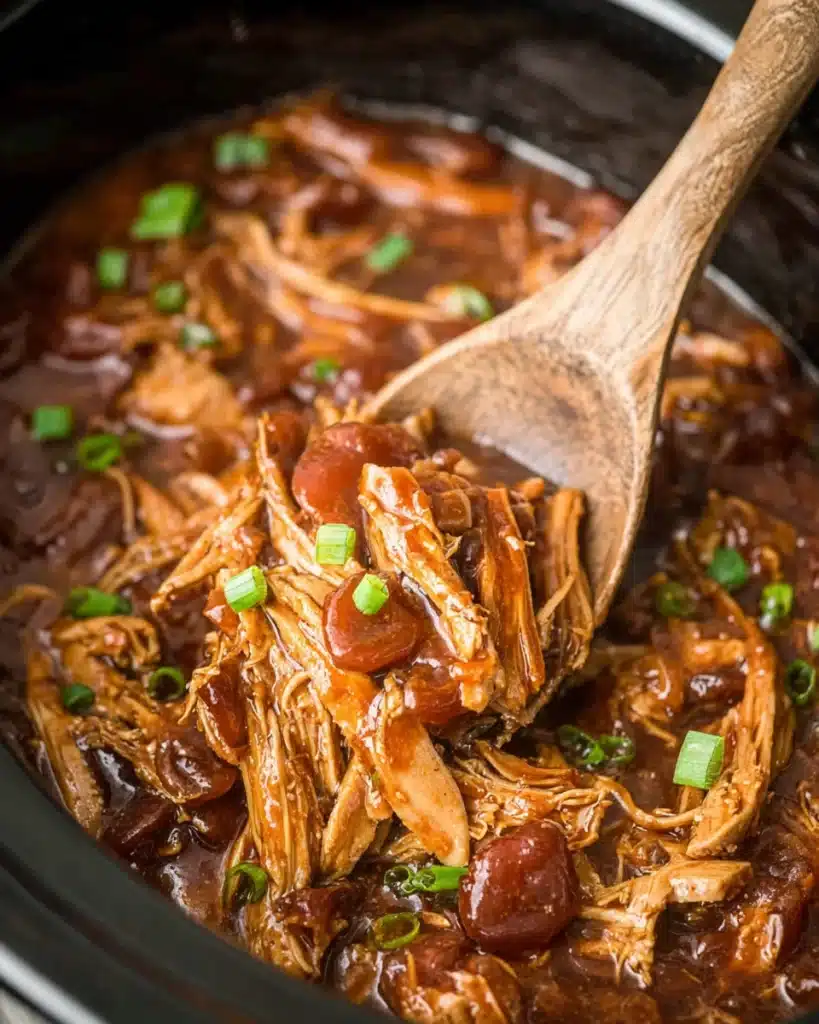 Crock Pot Bourbon Chicken 6 Close-up of Crock Pot bourbon chicken with glossy sauce and green onions