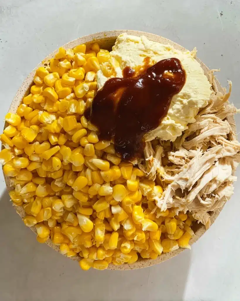Chicken wrap filling with sweetcorn, cream cheese, and barbecue sauce in bowl