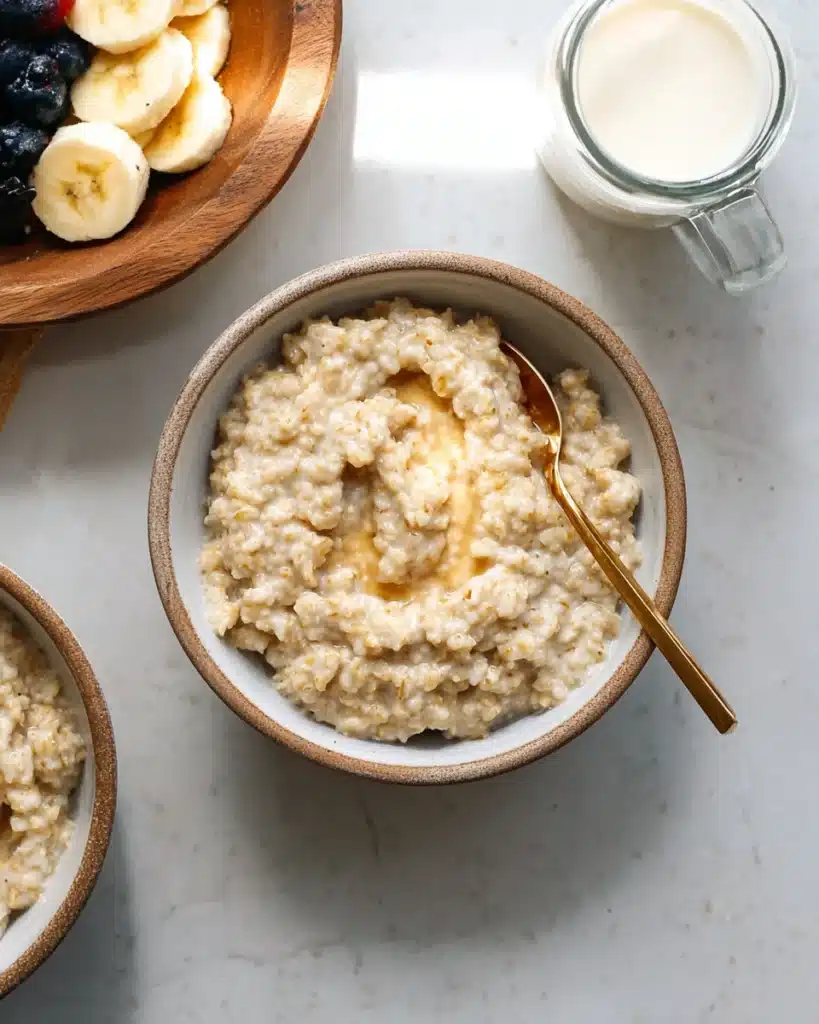Creamy Instant Pot steel cut oats in a bowl with a spoon