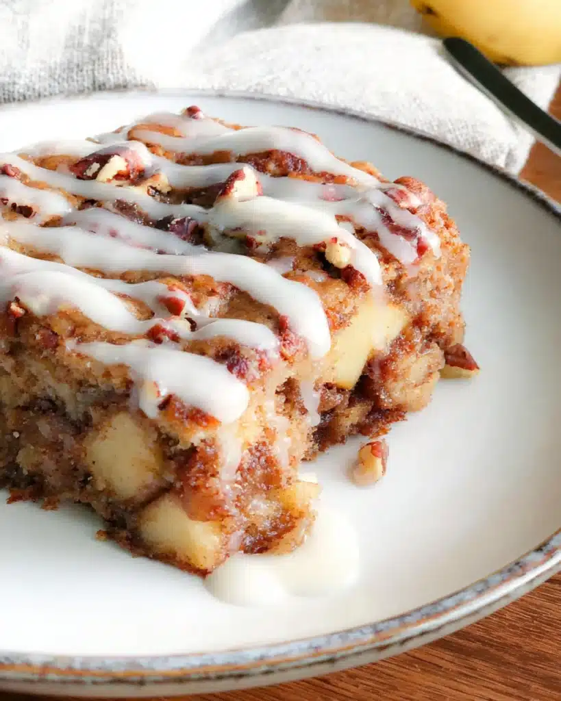 Oatmeal Apple Breakfast Bake Recipe 1 Slice of Oatmeal Apple Breakfast Bake with icing and chopped nuts