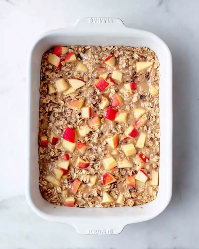 Oatmeal Apple Breakfast Bake Recipe 5 Oatmeal Apple Breakfast Bake mixture in white baking dish before baking