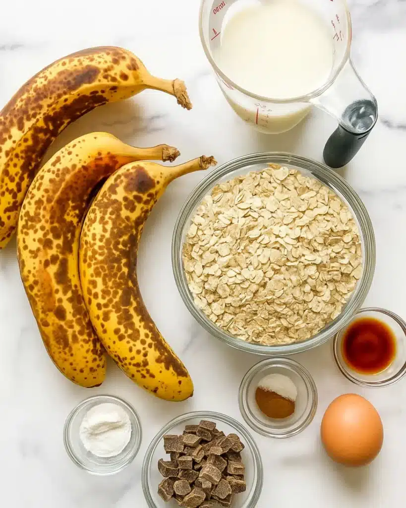 Banana Oat Muffins 2 Banana oat muffin ingredients flat lay on white marble
