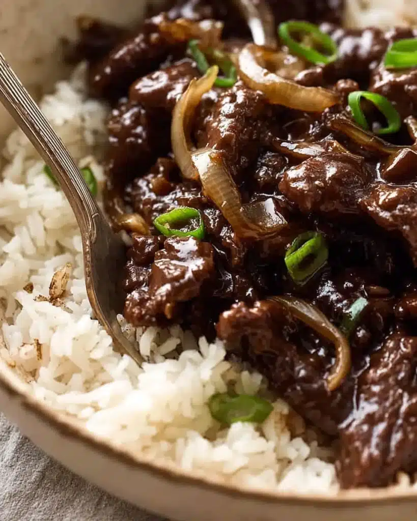 Beef Stir Fry with Honey Pepper Sauce 3 Beef stir fry with honey pepper sauce served over rice in a bowl