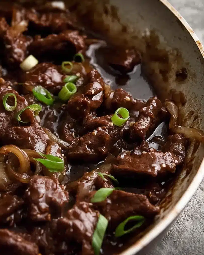 Beef Stir Fry with Honey Pepper Sauce 2 Close-up of beef stir fry with honey pepper sauce simmering in glossy brown glaze