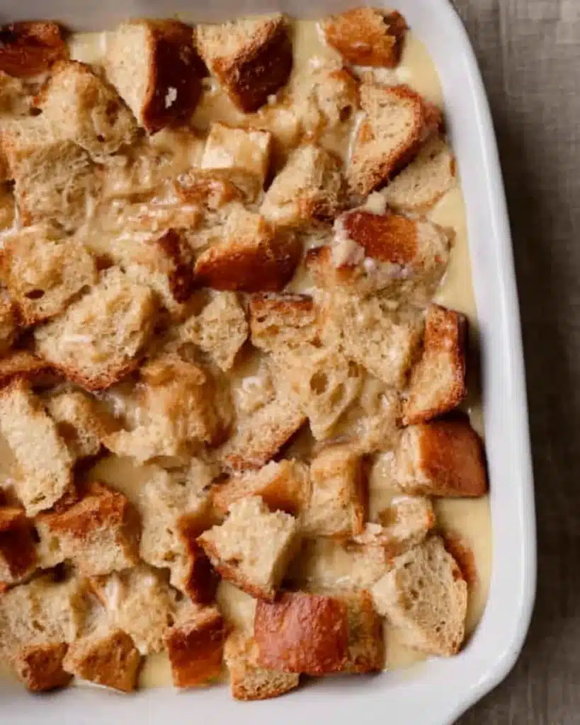 Brioche French Toast Casserole 2 Brioche bread cubes soaked in custard in casserole dish before baking