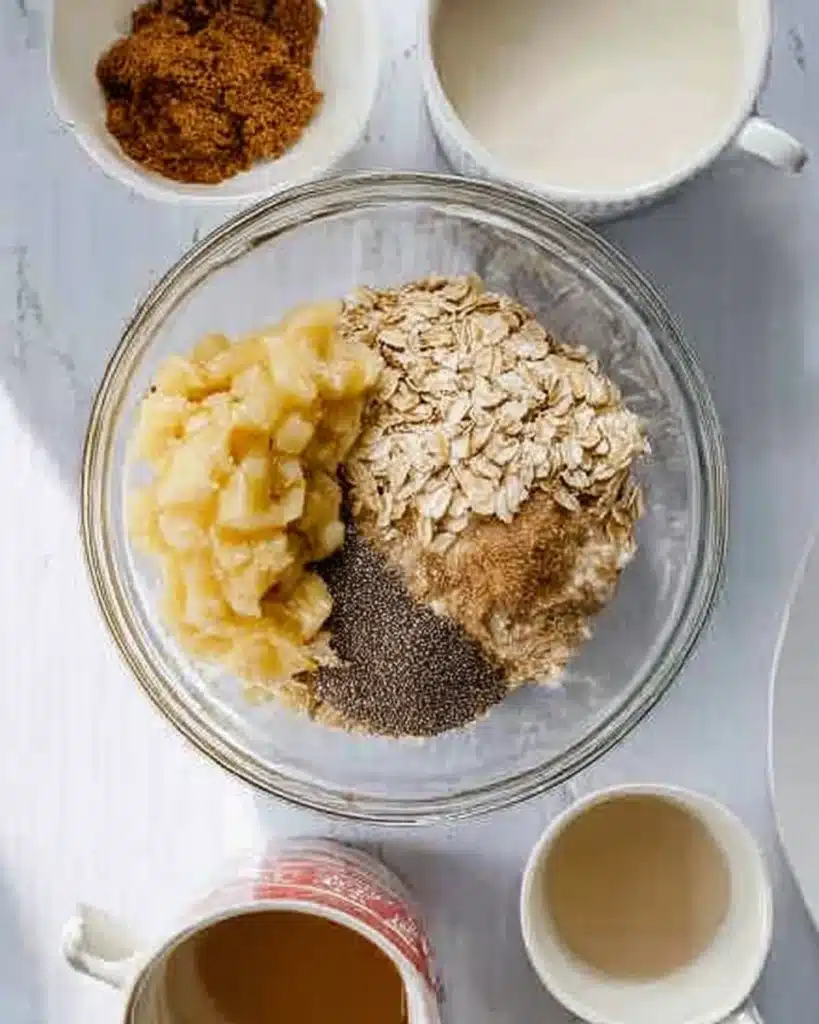 Brown Sugar Overnight Oats 2 Ingredients for brown sugar overnight oats with banana, oats, chia seeds, and brown sugar in a glass bowl