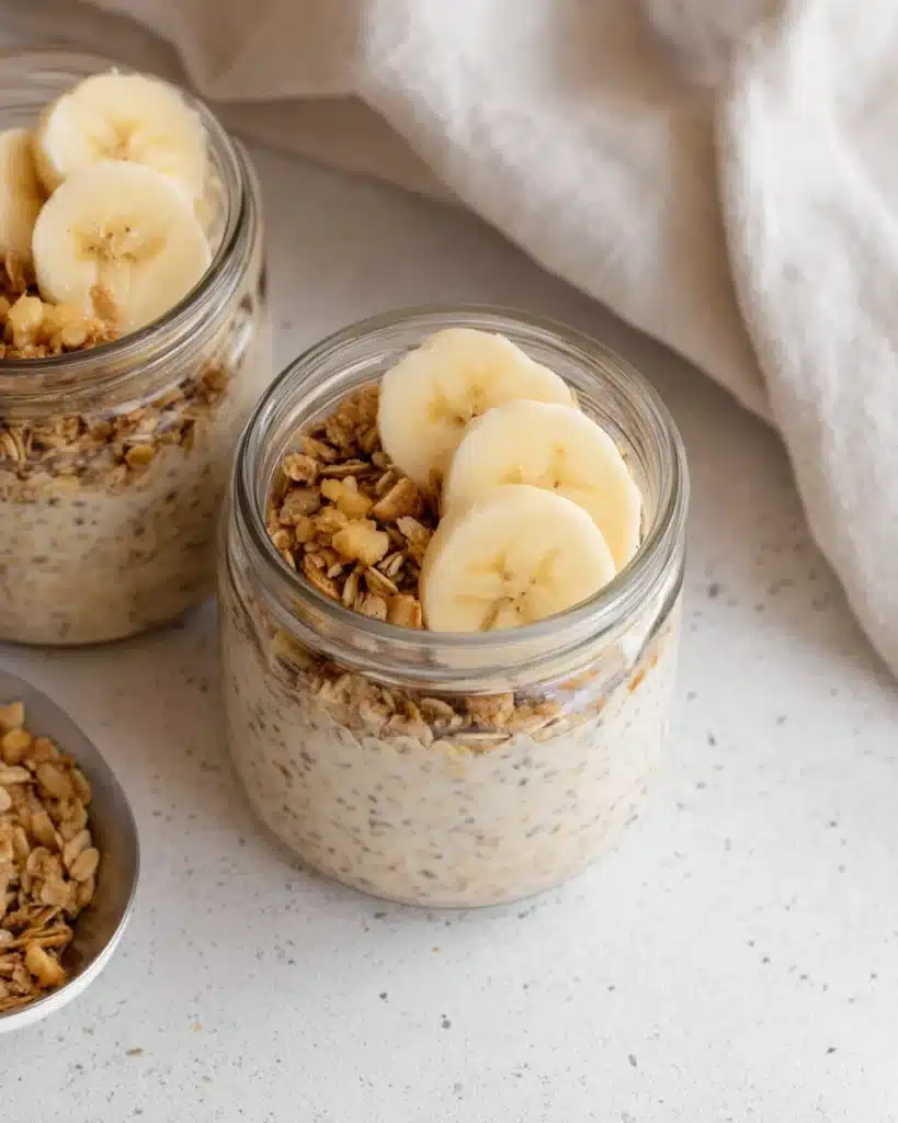 Brown Sugar Overnight Oats 1 Brown sugar overnight oats in glass jars topped with banana slices and granola