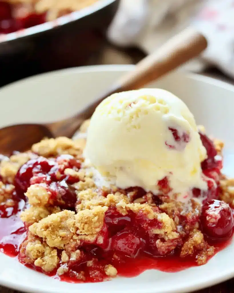 Cherry Dump Cake 1 Cherry dump cake with vanilla ice cream on white plate