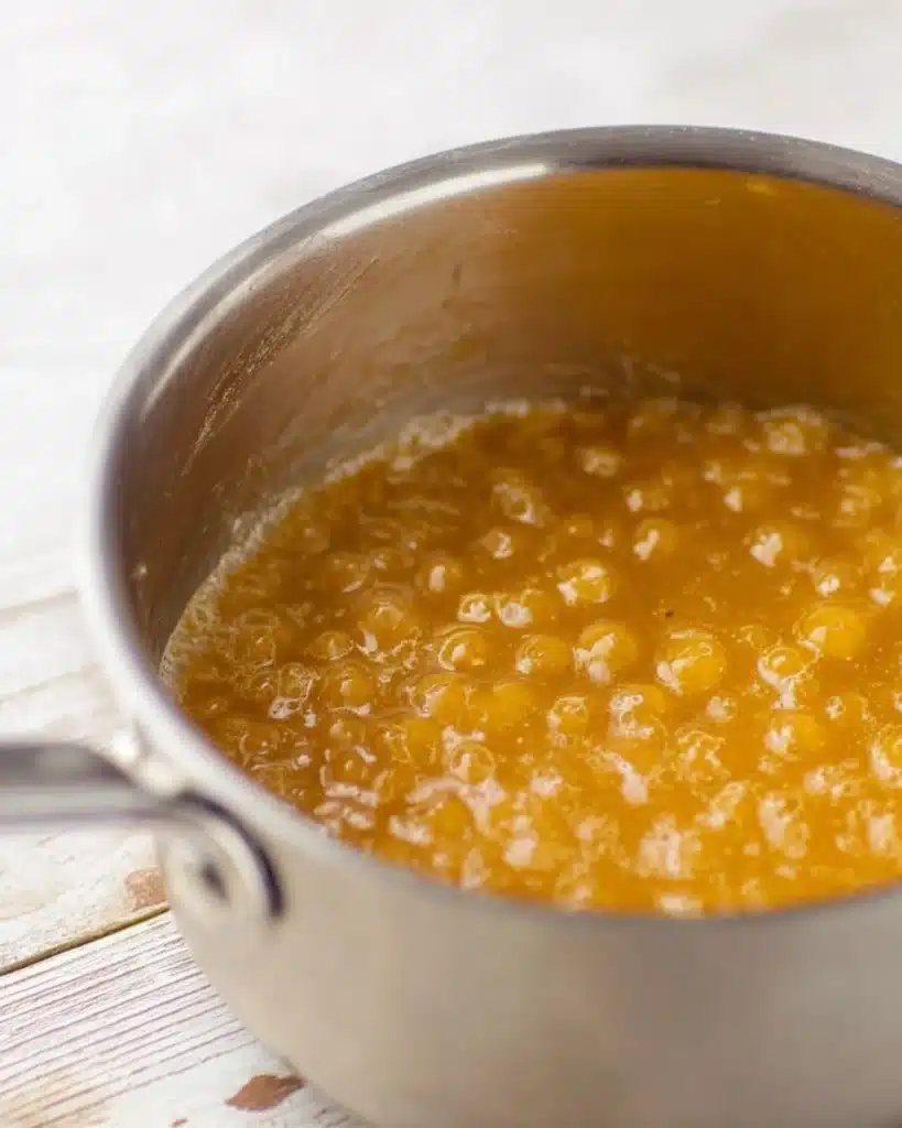 Christmas Crack (Saltine Cracker Toffee Recipe) 2 Bubbling golden toffee mixture in saucepan for Christmas Crack