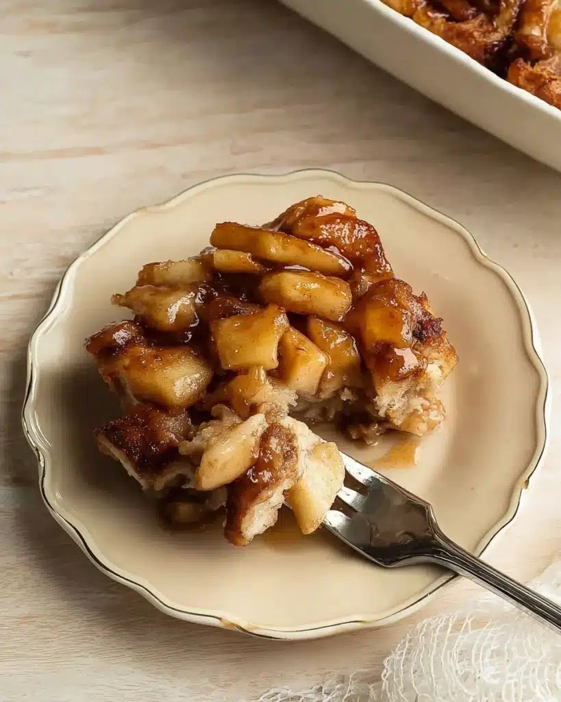 Cinnamon Rolls and Apple Pie Filling 5 Plated serving of cinnamon rolls and apple pie filling with caramelized apples
