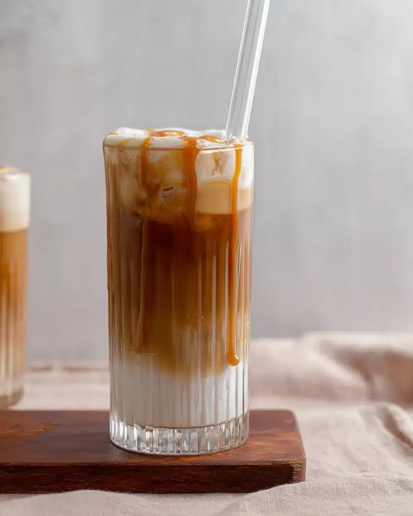 Starbucks salted caramel cold foam cold brew and caramel drizzle in a ribbed glass