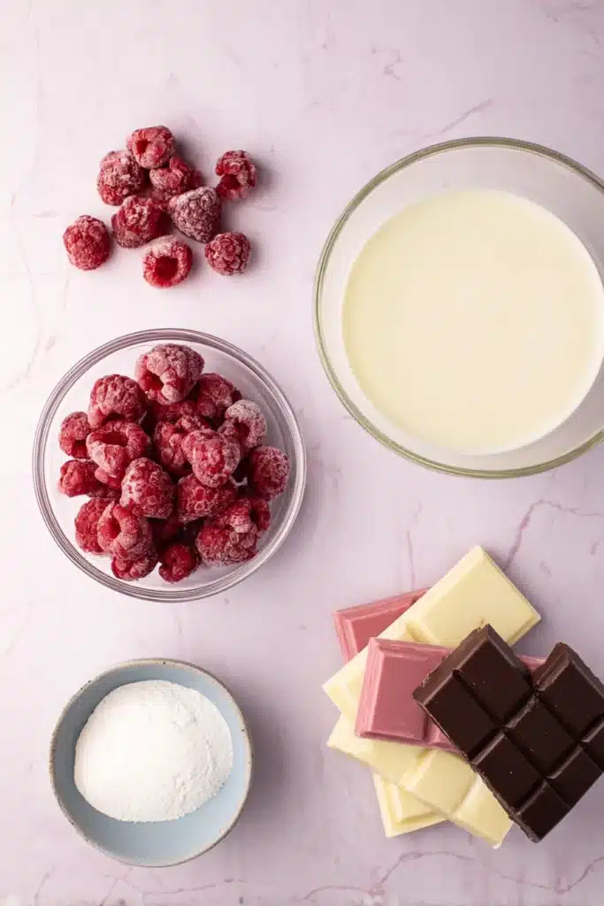 Chocolate Raspberry Truffles 2 Chocolate Raspberry Truffle ingredients with raspberries and chocolate bars