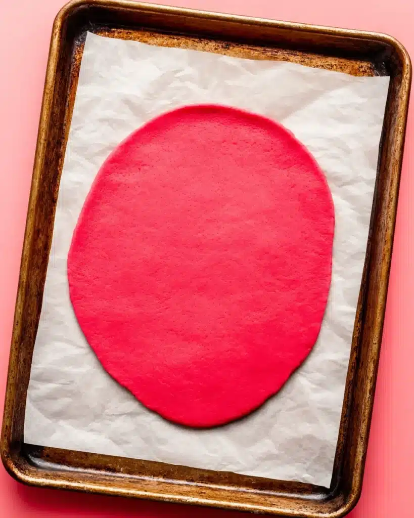 Heart Cookies – Sweet Valentine’s Day Slice-and-Bake Treat 3 Rolled pink heart cookies dough on parchment paper
