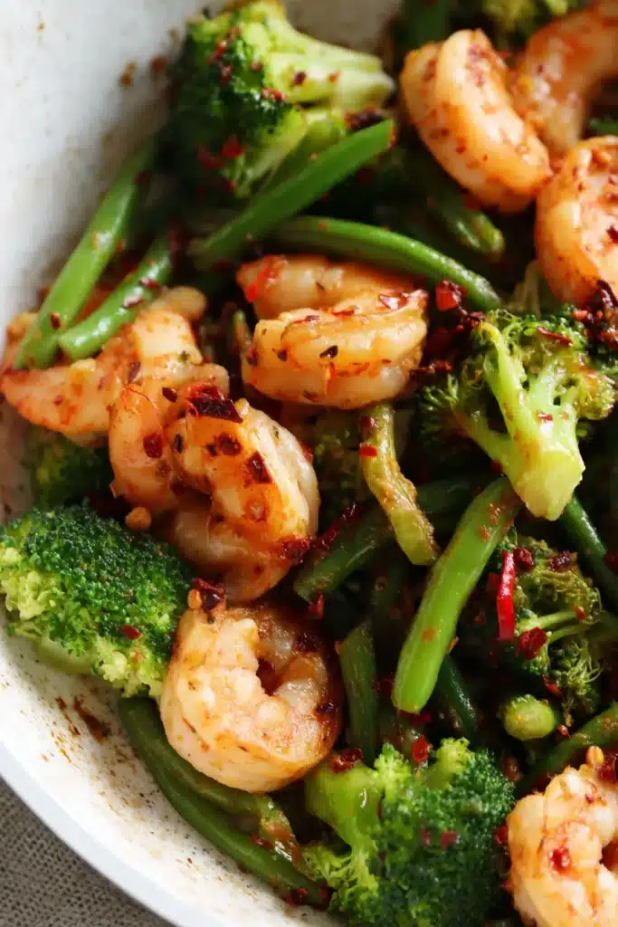 15-Minute Spicy Shrimp And Vegetable Stir-Fry 2 15-Minute Spicy Shrimp And Vegetable Stir-Fry in white skillet with broccoli and green beans