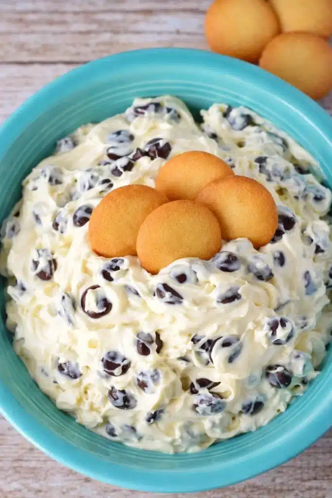 Chocolate Chip Dip Recipe – No-Bake Cheesecake-Style Dessert 2 Chocolate chip dip with vanilla wafers in turquoise bowl