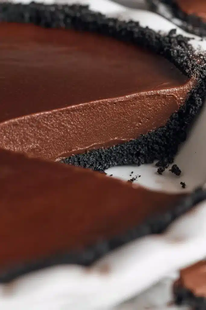 Life-Changing Chocolate Pie Recipe 2 Close-up of chocolate pie with glossy filling and Oreo crust