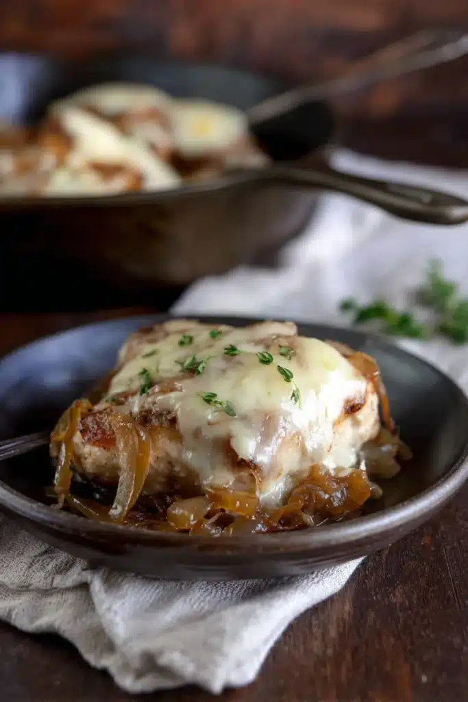 French Onion Chicken 5 Plated French Onion Chicken topped with melted cheese and caramelized onions