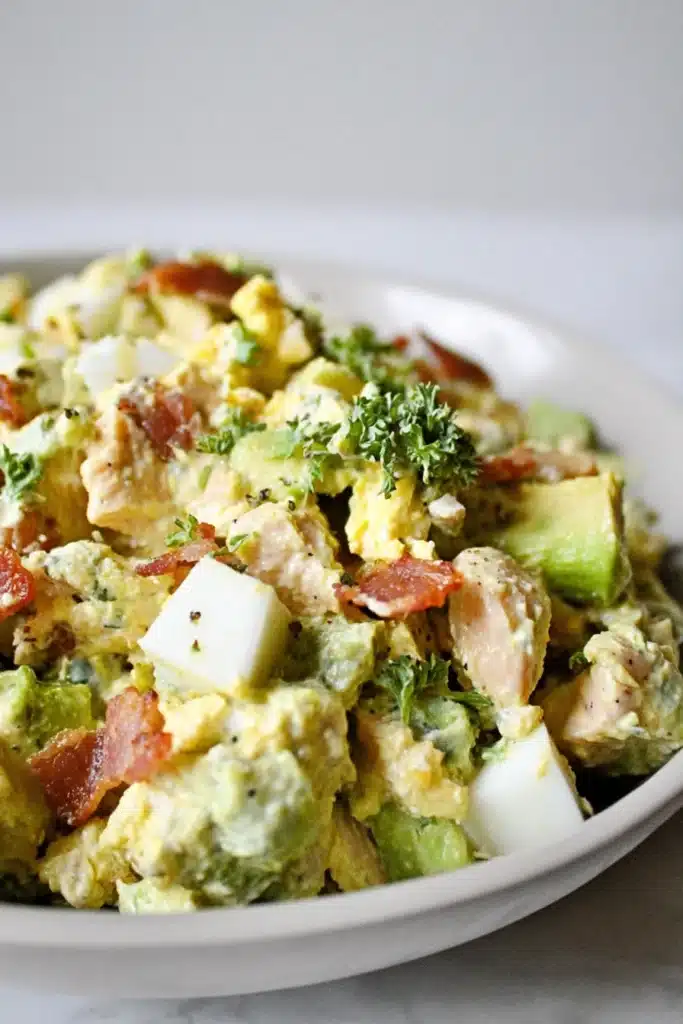 Low Carb Chicken Egg Salad (Easy Keto High-Protein Lunch Recipe) 1 Low carb chicken egg salad with avocado and crispy bacon in a creamy dressing