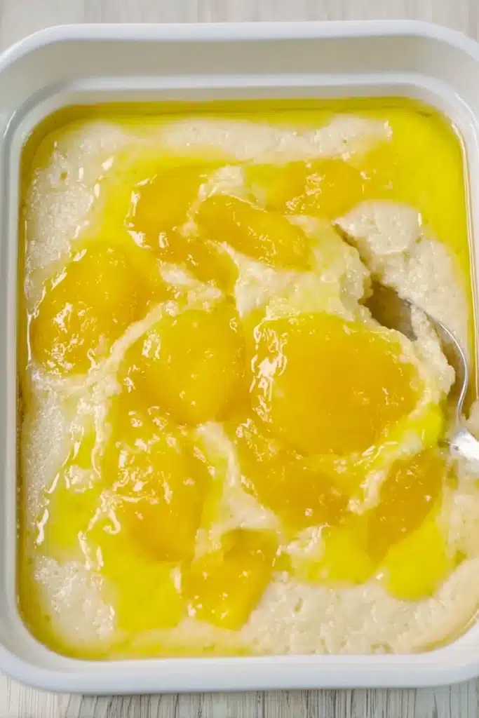 Magic Lemon Cobbler Recipe 3 Unbaked Magic Lemon Cobbler with lemon filling and batter in white dish