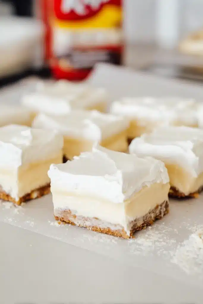 No-Bake Banana Cream Pie Bars (Easy Layered Dessert with Vanilla Wafer Crust) 1 No-bake banana cream pie bars with vanilla wafer crust and whipped topping