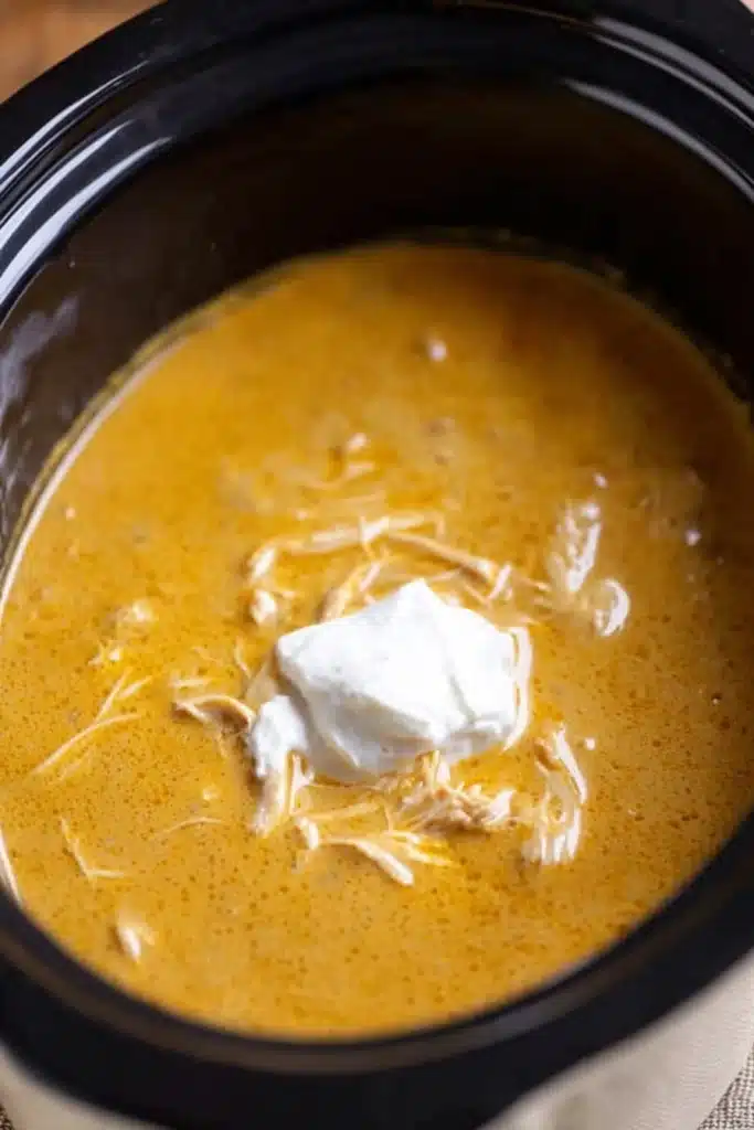 Crock Pot Chicken and Gravy Easy Comfort Classic 2 Crock Pot Chicken and Gravy with sour cream in slow cooker