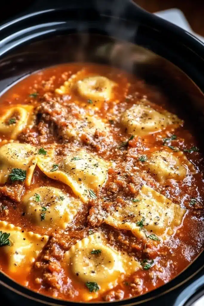Crockpot ravioli lasagna with cheese-filled pasta in rich tomato sauce