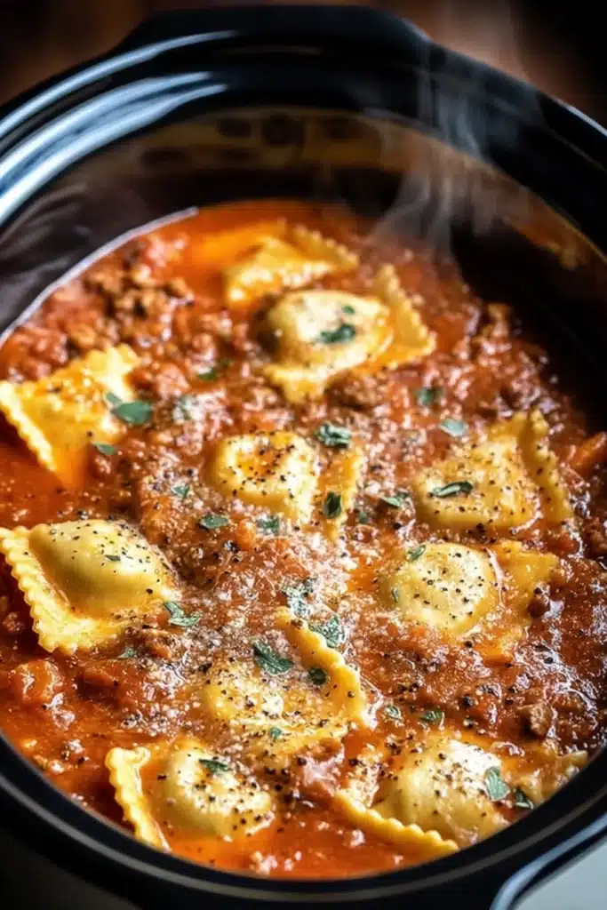 Crockpot ravioli lasagna with cheese-filled pasta in rich tomato sauce