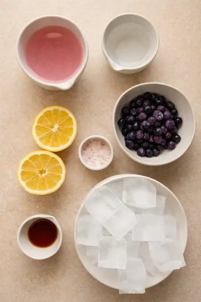 Natures Gatorade ingredients with coconut water, lemon, salt, fruit, and ice cubes