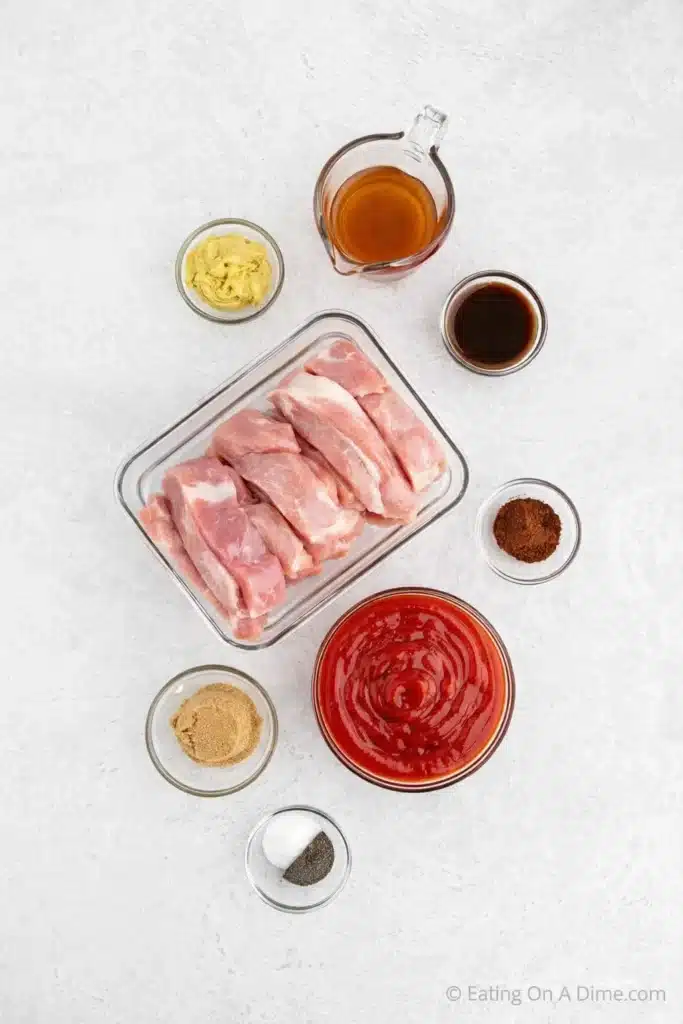 Ingredients for slow cooker country-style ribs on a light surface