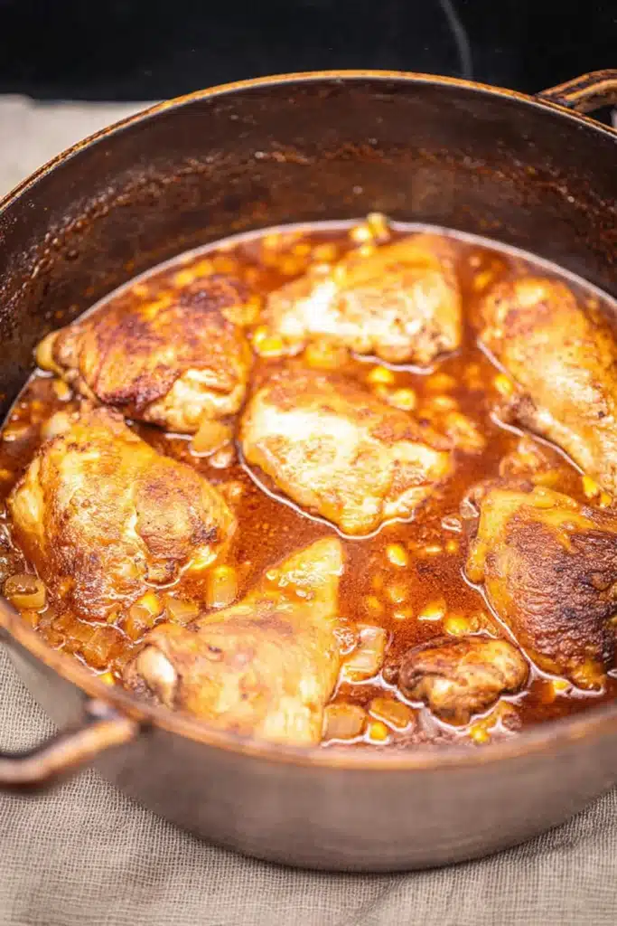 Chicken Paprikash simmering in rich paprika sauce with tender chicken