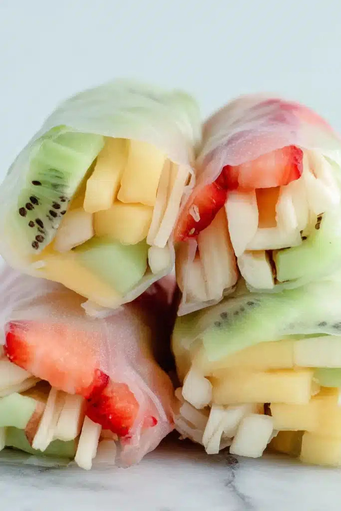 Fruit Spring Rolls 1 Fresh fruit spring rolls with colorful sliced fruit wrapped in soft rice paper