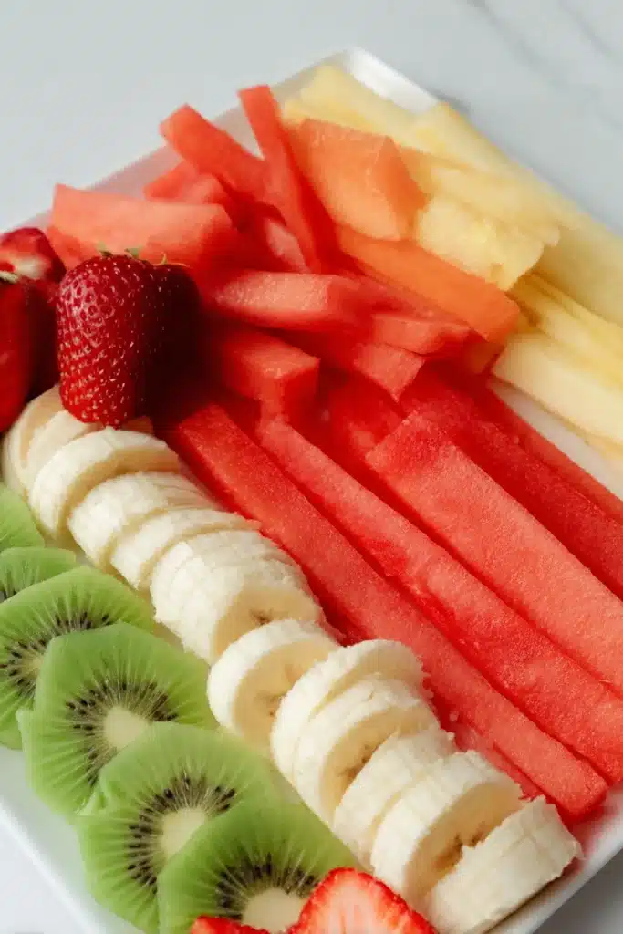 Fruit Spring Rolls 2 Fresh sliced fruits for fruit spring rolls including kiwi, strawberry, pineapple and watermelon