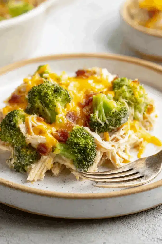 Low Carb Chicken Casserole That’s Creamy, Cheesy, and So Satisfying 2 Low Carb Chicken Casserole with broccoli, bacon, and melted cheddar on plate