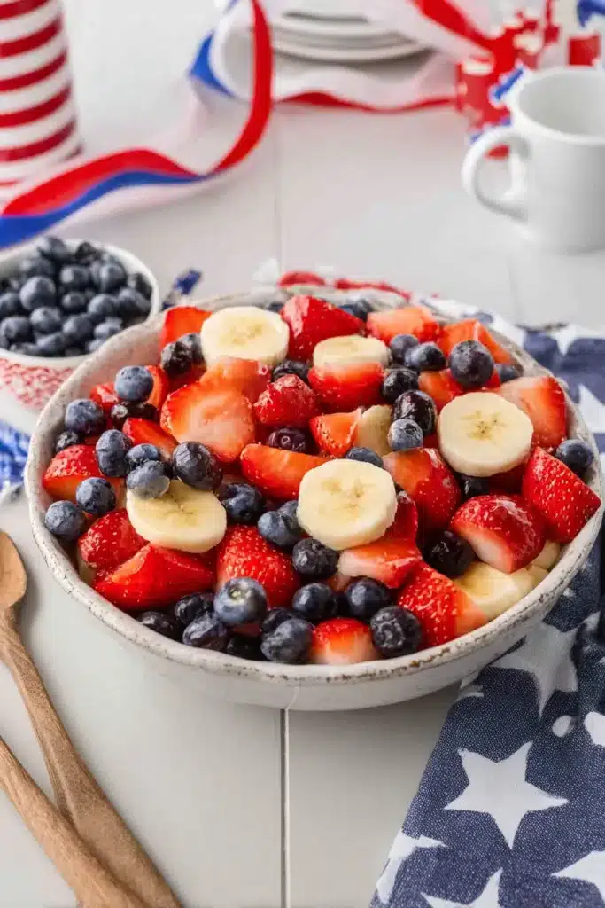 4th of July fruit salad with strawberries blueberries and bananas in a bowl