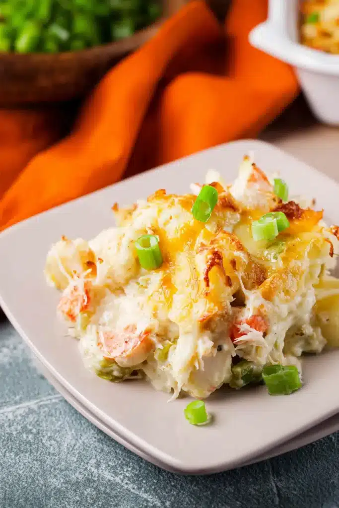 Chinese Buffet Crab Casserole Easy Creamy Recipe 2 Chinese Buffet Crab Casserole served on plate with melted cheese and green onions