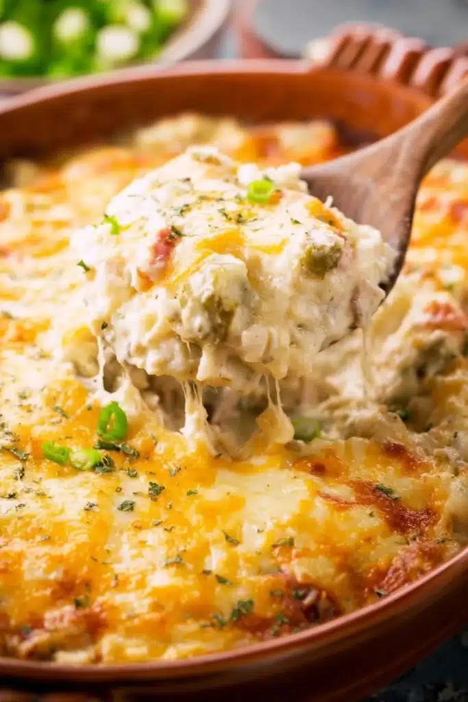 Chinese Buffet Crab Casserole Easy Creamy Recipe 1 Chinese buffet crab casserole with melted cheese and green onions on a spoon