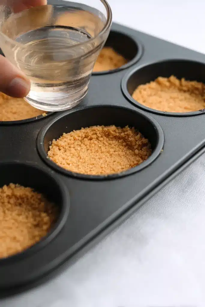 Mini Margarita Cheesecakes 2 Mini Margarita Cheesecakes crust pressed into muffin tin