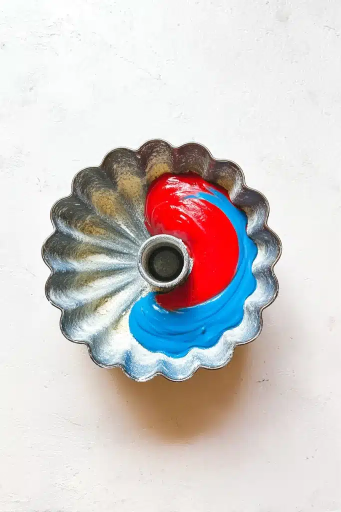 Red White And Blue Marble Cake 2 Red White And Blue Marble Cake batter in bundt pan before baking