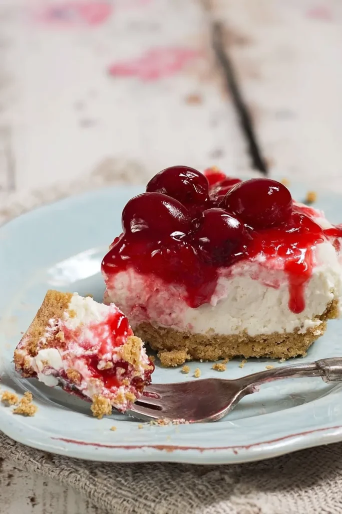 Classic Cherry Delight slice with creamy layers and glossy cherry topping