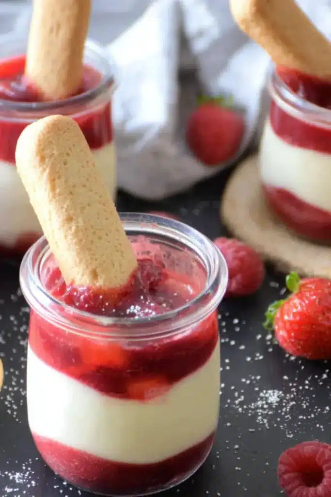 Rhubarb Cheesecake Creams with biscuit dipped into creamy and tangy layered dessert