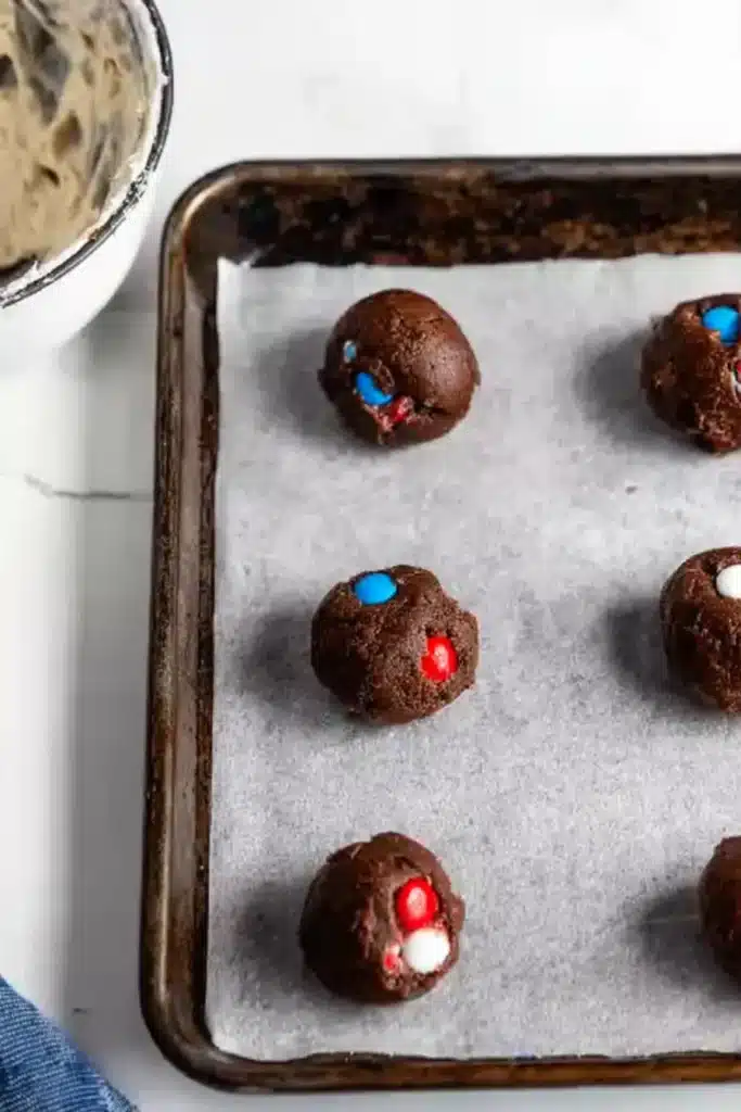 4th of July Cookies 3 4th of July Cookies dough balls on parchment lined baking sheet
