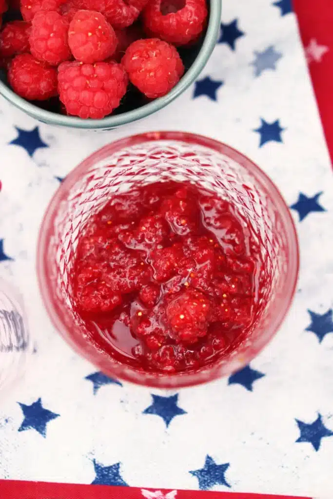 4th Of July Mojito 2 4th Of July Mojito raspberry base with crushed fresh berries in a festive glass
